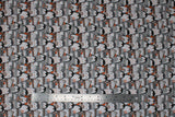 Flat swatch cozy penguin stack fabric (tight collage rows of cartoon black and grey penguins with various winterwear on in green and orange colourway)