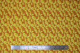 Flat swatch St. Patrick's Day themed fabric in gold coins collage