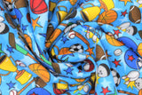 Swirled swatch sports printed flannel (blue fabric with light blue stars and tossed sports equipment in full colour, basketballs, soccer balls, wooden baseball bats, footballs, bowling balls and pins, gold trophy's, etc. with blue, red, orange, and green tossed stars)