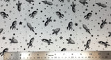 Flat swatch cartoon rocketships and stars fabric in grey (white fabric with small tossed grey rocketships and stars)