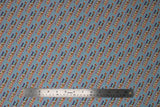 Flat swatch Yass fabric (teal blue fabric with diagonal repeated "Yass!" text in white letting with rainbow dash horse running through)