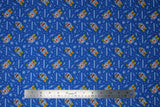 Flat swatch mashtronaut fabric (blue fabric with astronaut style mr. potato heads with "mashstronaut" text and tossed white tiny space emblems)