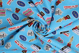 Swirled swatch mike sticker fabric (bright blue fabric with tossed mike related office emblembs in full colour cartoon style tossed allover: mugs, awards, name tags, etc.)