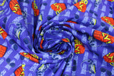 Swirled swatch McFly fabric (blue fabric with tossed 'McFly!' text in yellow over red vests tossed with glasses and cars and small light blue movie titles)