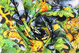 Swirled swatch A Rare Occasion fabric (busy full colour animal collage: jungle greenery and elephants, zebras, birds, monkeys, tigers, etc.)