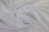 Swirled swatch white Marble Drapery Lace (tight mesh with busy floral/stem like design allover)