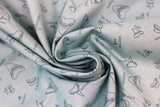 Swirled swatch Shark Teeth fabric (dark blue-grey fabric with tossed shark tooth outlines in various styles with small written labels)