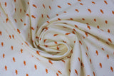 Swirled swatch Sharkies fabric (white fabric with scattered lines of tiny orange shark silhouettes)