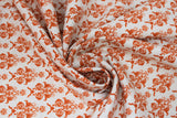 Swirled swatch Eggshell fabric (off white fabric with small burnt orange ornate/victorian design allover)