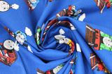 Swirled swatch Tossed fabric (medium blue fabric with tossed full colour character trains and black directional arrows, etc.)