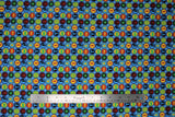 Flat swatch Symbols fabric (light blue fabric with stripes of circular badges allover with train related symbols within in bright colours)