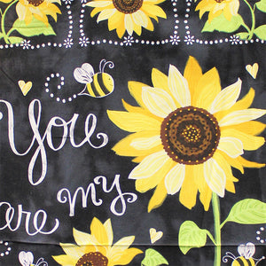 Square swatch - You Are My Sunshine Panel - 24" x 45" (black marbled look panel with large "You are my sunshine" text and illustrative style sunflowers and bees with 6 square framed sunflowers on top and bottom)