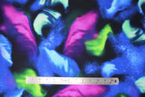 Flat swatch magic sky fabric (black fabric with large tossed blue, green and pink light forms with white small star dots)
