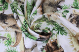 Swirled swatch Allover Dinosaurs fabric (white fabric with illustrative look dinosaurs and trees allover in green, and brown shades)