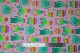 Flat swatch kitty cactus fabric (baby pink fabric with lines of green kitty shaped cacti with closed-eye faces in pink/teal decorative pots, tossed red and pink hearts)