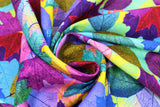 Swirled swatch Bright Painted Leaves fabric (bright coloured leaf collage allover in bright and pastel rainbow shades)