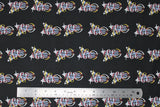 Flat swatch feather themed print in feathers black (black solid fabric with repeated feather design two white/grey feathers crossing with white/red/yellow ribbons wrapping around)