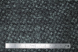 Flat swatch journey themed fabric in airplane texture charcoal (dark grey/black marbled watercolour look fabric with light grey marbled airplane shapes tiled/criss crossing)