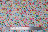 Flat swatch moth floral fabric (white fabric with small tossed floral and greenery allover in pink, orange, yellow, blue, green with tossed green/teal painted moths small)
