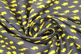 Swirled swatch lightning fabric (black fabric with repeated yellow lightning bolts varying slightly in style)