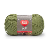 Ball of Red Heart soft yarn in leaf (pale medium/dark green)