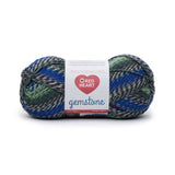 Ball of Red Heart Gemstone yarn in shade sapphire (light to dark faded blue/greens colourway with twists) 