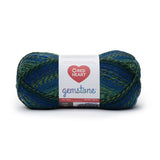 Ball of Red Heart Gemstone yarn in shade emerald (medium to dark faded blues, medium to dark faded greens colourway with twists)