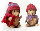 Completed Amigurumi hedgehogs with pink and purple hats/scarves