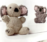 Completed Amigurumi koalas (grey/black with pink)