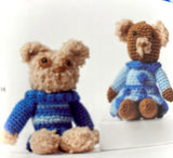 Completed Amigurumi bears (light and dark brown mini teddy bears wearing blue patterned sweaters)