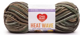 Ball of Red Heart Heat Wave yarn in shade campfire (white, browns, taupe, green colourway)