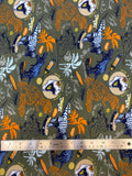 Flat swatch knit material in dino green (skateboarding dinosaurs with palm trees and boards on green/grey)