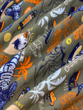 Swirled swatch knit material in dino green (skateboarding dinosaurs with palm trees and boards on green/grey)