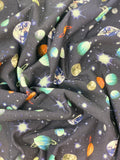 Crinkled swatch knit material in space brushed blue (space sky with planets and stars on deep blue)