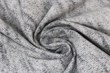 Swirled swatch light grey knit fabric (light grey knit look fabric with subtle black accents)