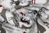 Swirled swatch forest park fabric (white fabric with layered moose, bear, tree, and fox outlines and silhouettes in grey, black, and red/black buffalo check)
