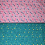 Group swatch assorted daisy printed fabrics in pink and aqua colours