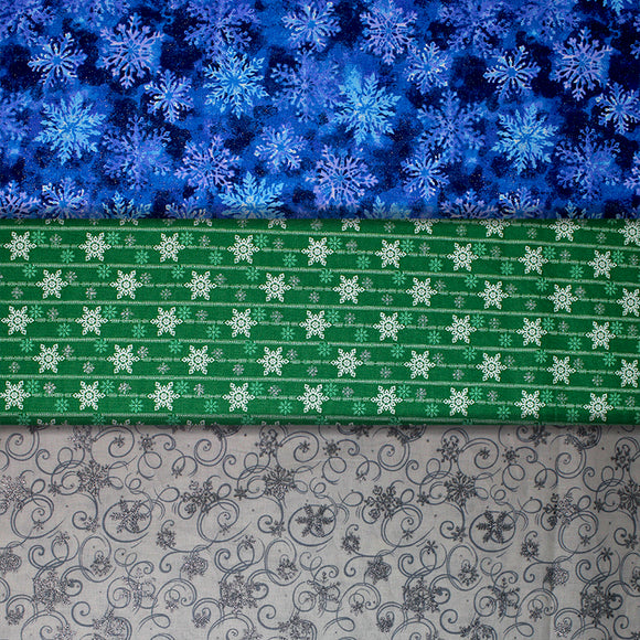 Group swatch assorted Snowflakes printed fabrics in various styles/colours