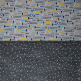 Group swatch assorted work zone themed fabrics in a variety of prints