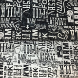 Group swatch farm to fork large font text printed fabric in black and cream