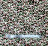 Blizzard fabric swatch (white fabric with busy holly leaves and berries in red and green allover)