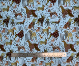 Flat swatch Dog Toss Aqua fabric (pale blue fabric with tossed dog silhouettes in geometric patchwork style design in neutral/brown shades)