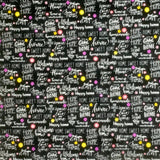 Square swatch At Home fabric (black fabric with white home related writing allover in various styles/fonts: "Home Sweet Home" "Happy home" etc. with small tossed yellow, pink and purple floral heads and dots)