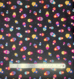 Little Matryoshka fabric swatch in black (black fabric with grey tossed dots and full colour tossed decorative Russian dolls in various sizes)