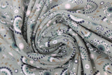 Swirled swatch floral printed fabric in flowers sage (faded sage green fabric with assorted white/grey/black/brown floral heads and stems tossed)