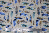 Flat swatch feather themed print in feathers (natural/light beige coloured fabric with assorted size blue/brown/white feathers with dull gold flecks)