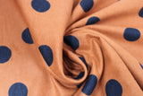 Swirled swatch orange polka dots fabric (burnt orange fabric with medium/large black polka dots)