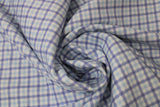 Swirled swatch blue gingham fabric (white fabric with faint light and dark blue gingham lines/pattern)