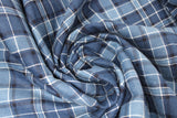 Swirled swatch blue plaid fabric (pale medium/dark blue plaid with white and black plaid lines in addition to multi blue hues)