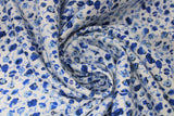 Swirled swatch blue dittys fabric (white fabric with busy tossed blue floral designs/drawings in ditty style)